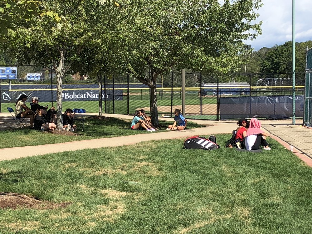 Students watching tennis during Fall Fest.