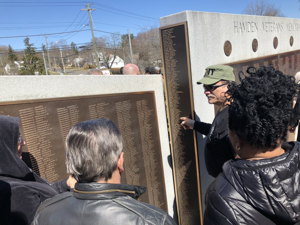 Upon the plaques unveiling family, friends, Hamden residents and veterans lined up to take a picture of the new plaque.