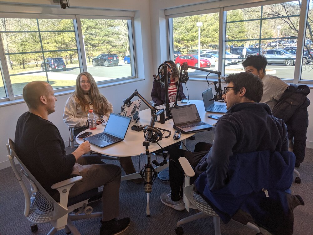 David DesRoches and students meet to discuss the studio and run through a sample podcast.