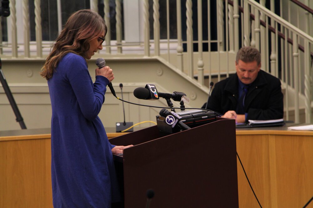 Amber Kelly giving comments to the Hamden Police Commission. Right, Bo Kocak. Photo by Bryan Proctor.