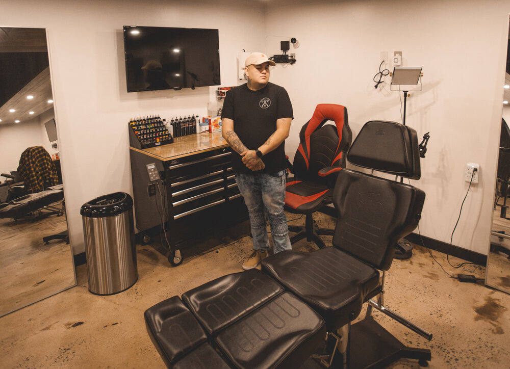 Dave Sevilla, at his tattoo station in the "Black Hatchet Burrow." Photo courtesy of Black Hatchet Tattoo Co.