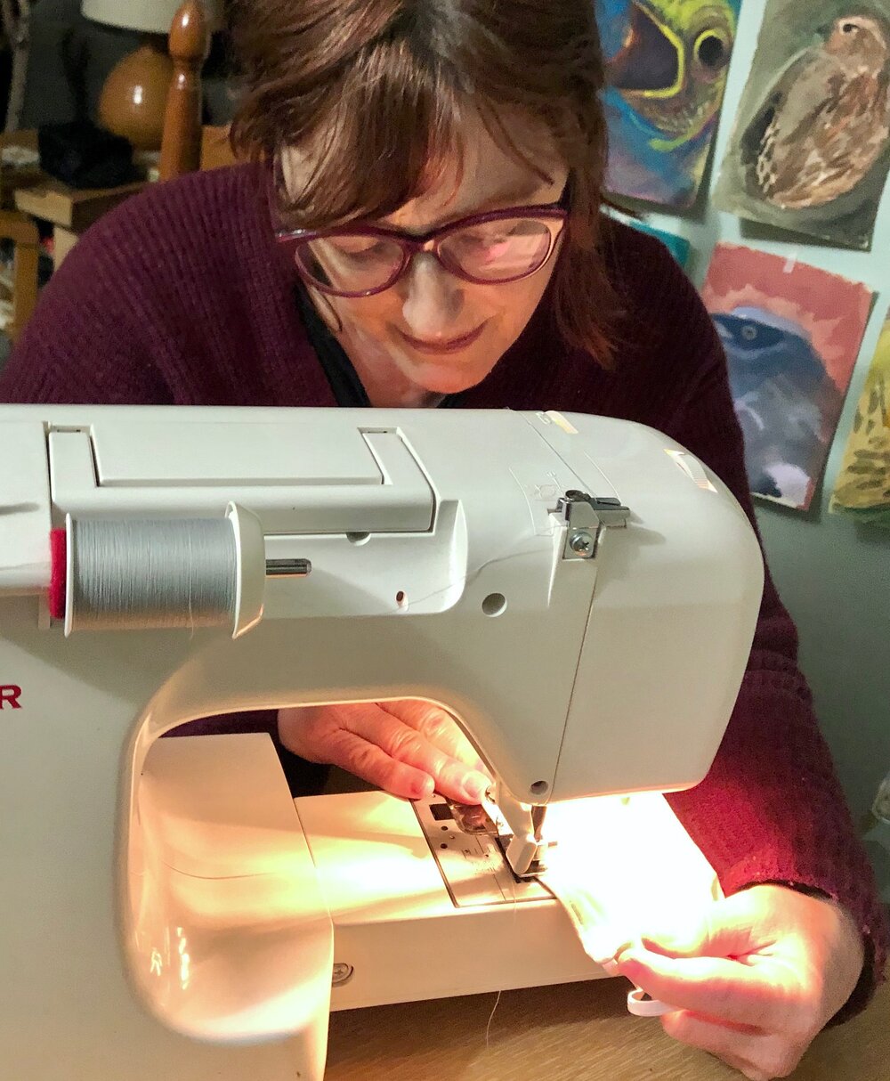 Volunteer Eva Scopino utilizes her sewing machine to help make face masks for the clients. Courtesy: Columbus House