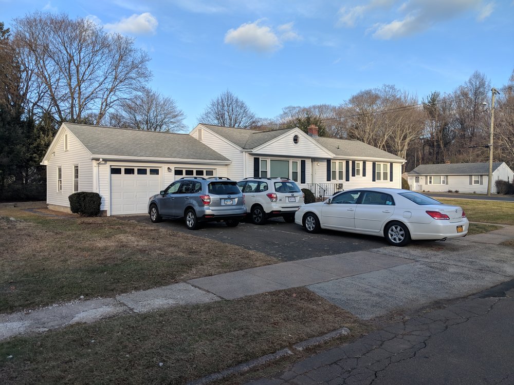 Student Housing with multiple cars in driveway