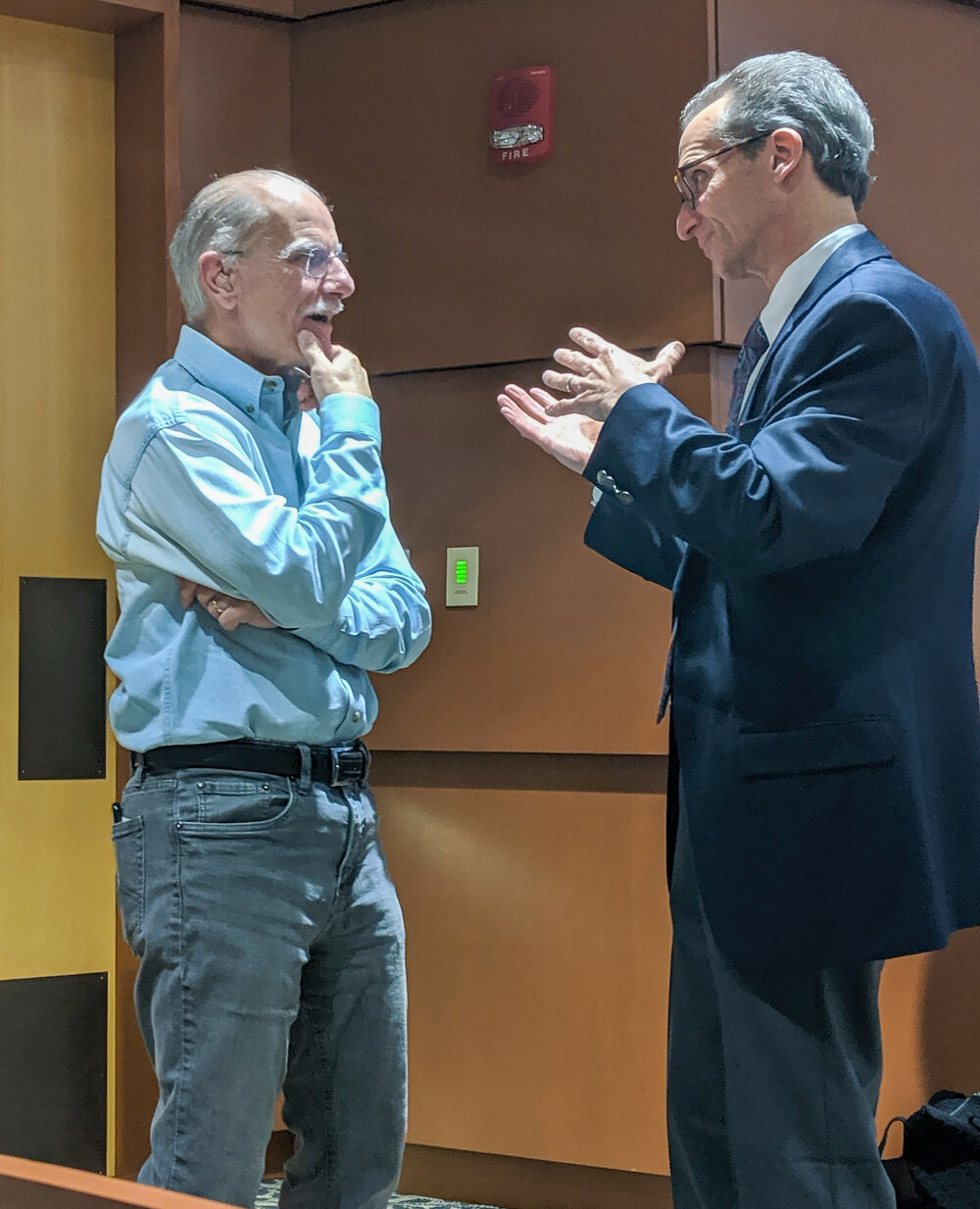 Nick Bellantoni and Eddy Rosenblatt conversing before the presentation. The two studied the same remains, and came to similar conclusions. Courtesy: Garret Amill