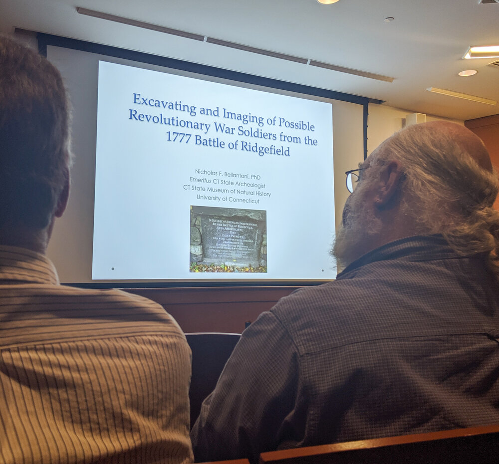 Audience members watch on as archaeologist Nick Bellatoni presents his findings. Courtesy: Garrett Amill