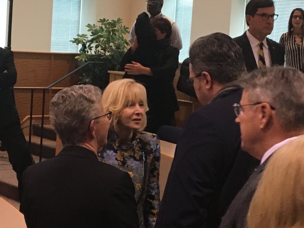 Olian takes time out to talk to Hamden mayor Curt B. Lang after her press conference.