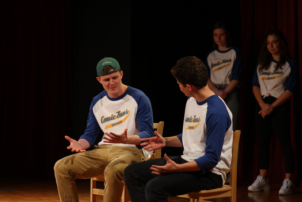 James Freeman and Frank Scott of Quinnipiac’s Improv troupe communicate during a scene.