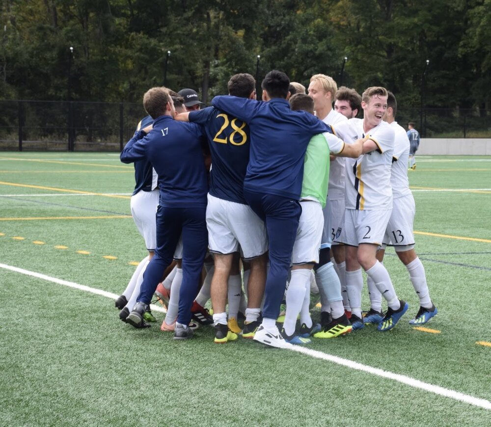 The Quinnipiac men’s soccer team celebrates a goal from last season. The Bobcats made it all the way to the MAAC finals in 2018, before losing 1-0 to Rider.