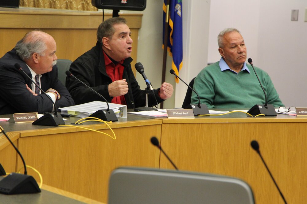 Michael Iezzi firing back at Dormus’ comments that Mitchell Strickland can’t look protesters in the eye. Left to right: Robert LaTorraca, Michael Iezzi, and Larry Esposito. Photo by Bryan Proctor.