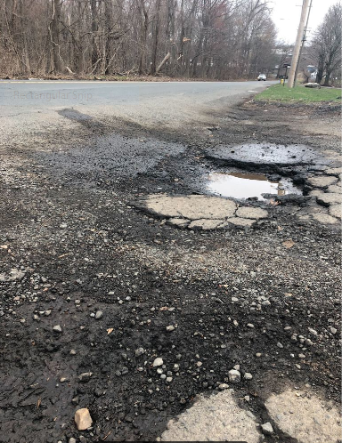 Potholes off of Sherman Avenue