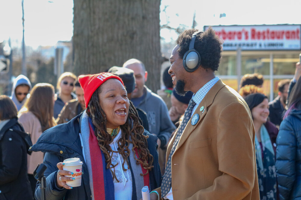 Justin Farmer, a current Hamden legislative council member running for state 17th district senate, is seen with one of 110 Hamden residents who attended his rally. Courtesy: Peter O’Neill