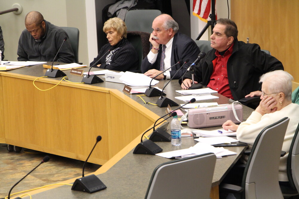 Hamden Police Commission members heard public comments, all of which were centered around the April 16 shooting and police brutality. Left to right: Mitchell Strickland, Raeanne Curtis, Michael Iezzi. Photo by Bryan Proctor.