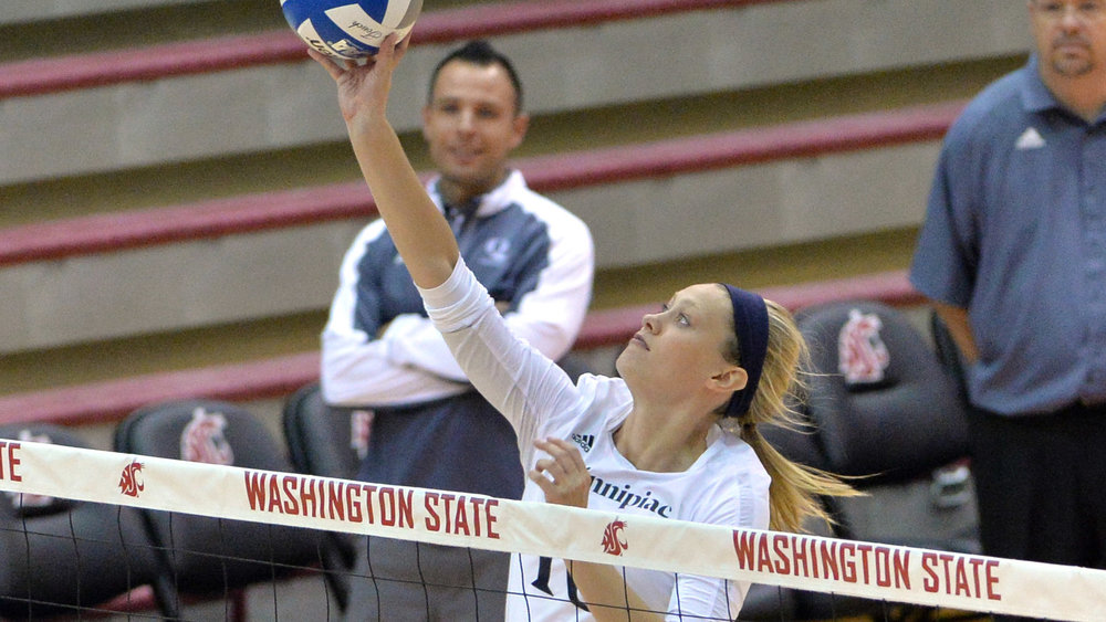 Elizabeth Kloos playing middle hitter during her senior year at Quinnipiac University.