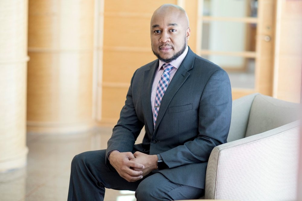 Chief Diversity Officer Don Sawyer sitting outside of the department of cultural and global engagement. Photo courtesy of Quinnipiac University.