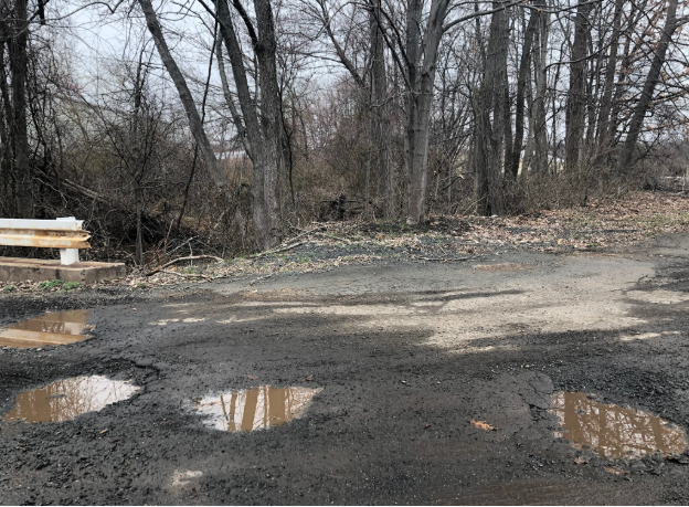 Potholes just off of Sherman Avenue  Photo by Kristina Mendoza-Cabrera