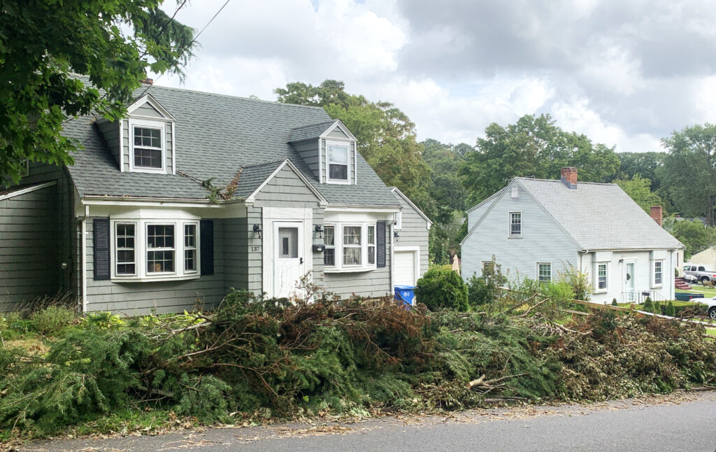 Tree crews were busy on Cannon Street off of Evergreen Avenue as they collected debris in the road, cutting up fallen trees and putting them on front lawns on Tuesday, Sept. 1, 2020. (Photo by Matthew Nygaard)