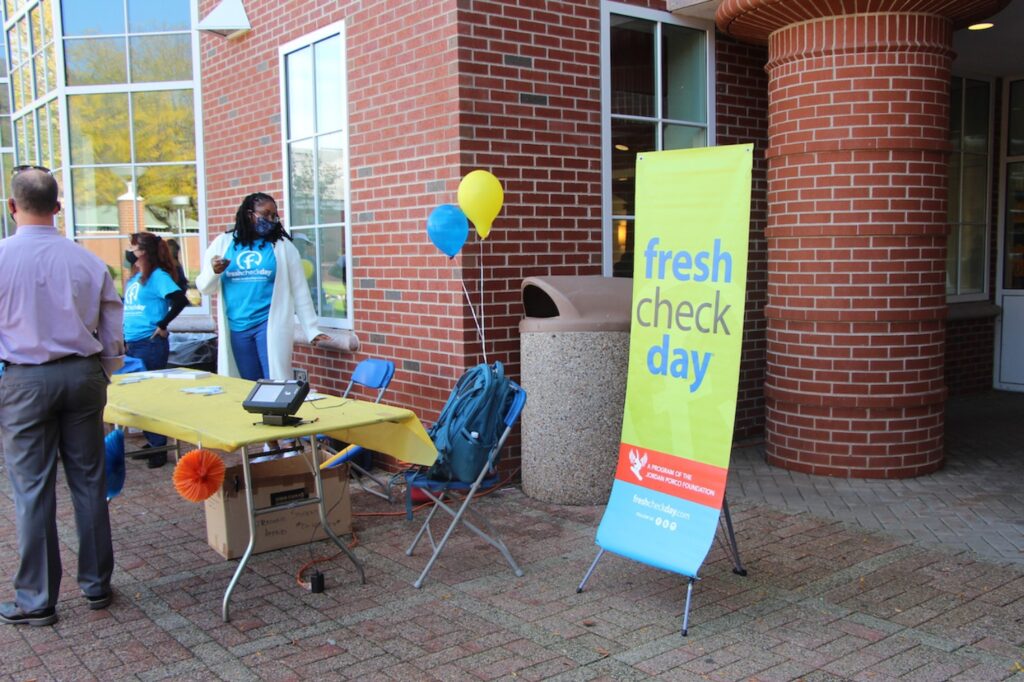 Volunteers from both the health center and counseling center, managed the check in booth for students wanting to check out the mental health day fair.
(Photo by Marianna Rappa)
