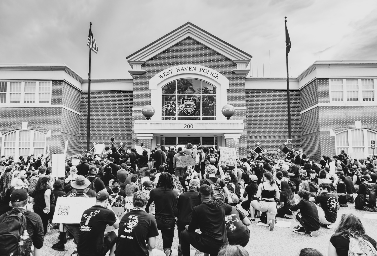 Black Lives Matter protesters gathered outside of the West Haven Police Department during a protest on June 6. (Photo by Dan Passapera)