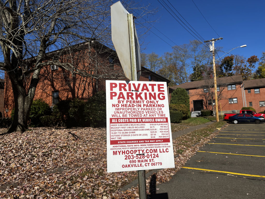 "Private Parking" sign advising parking rules for the lot