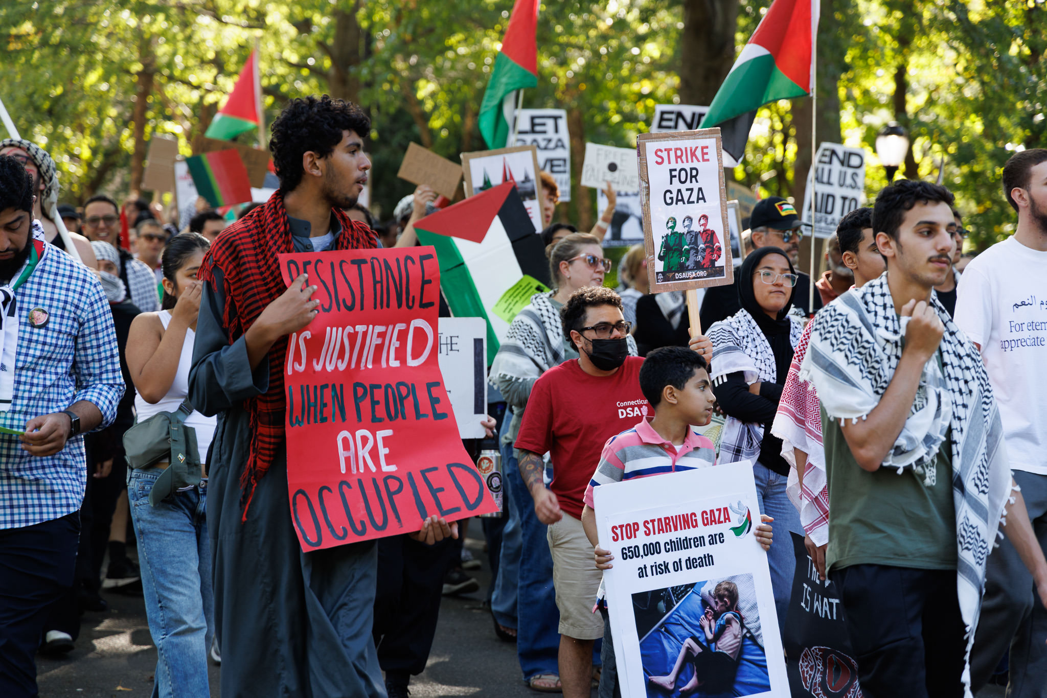 Pro-Palestinian activists march on New Haven Green during a protest on Oct. 5, 2025. Photo by Anthony Rodriguez.