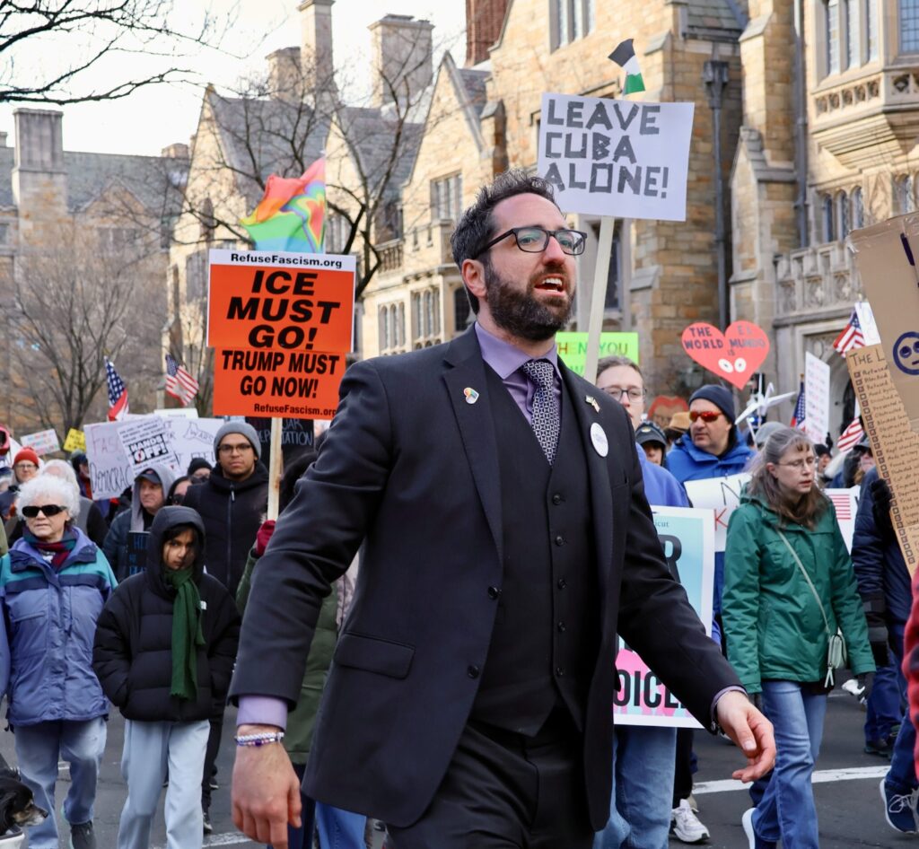 Andrew Rice, a candidate challenging Rep. Rosa DeLauro for Connecticut’s 3rd Congressional District, marches alongside demonstrators. Hannah Freshman/HQNN