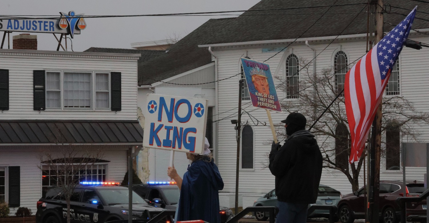 Hamden police vehicles monitor the rally outside Hamden Town Hall, observing the gathering and ensuring safety. Hannah Freshman/HQNN