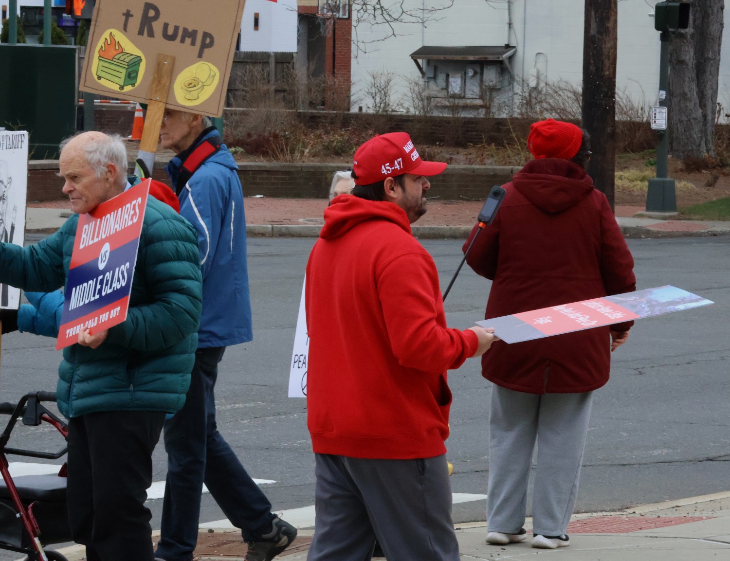 Counter-protester Robert Vardaro holds a 360-degree camera mounted on a handheld stick as he films interactions with demonstrators. Hannah Freshman/HQNN