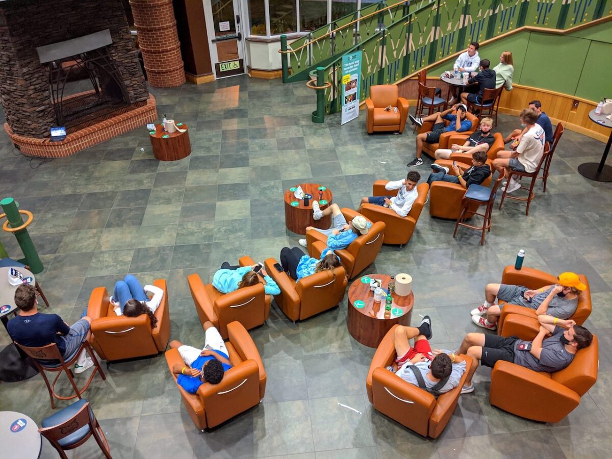 A group of about 20 students congregated inside the Student Center at Quinnipiac University on Monday, Aug. 31, 2020. Most did not have masks and spent at least an hour watching basketball on the big screen TV inside. (Photo by Wasim Ahmad)