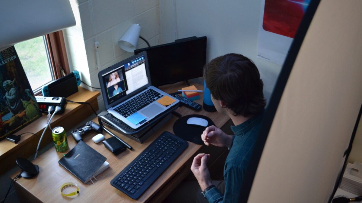 Nicholas Fetherson, President of 4th Wall Student Theater, practicing for a callback with a classmate over Zoom from his residence hall. (Photo by Owen Doody)