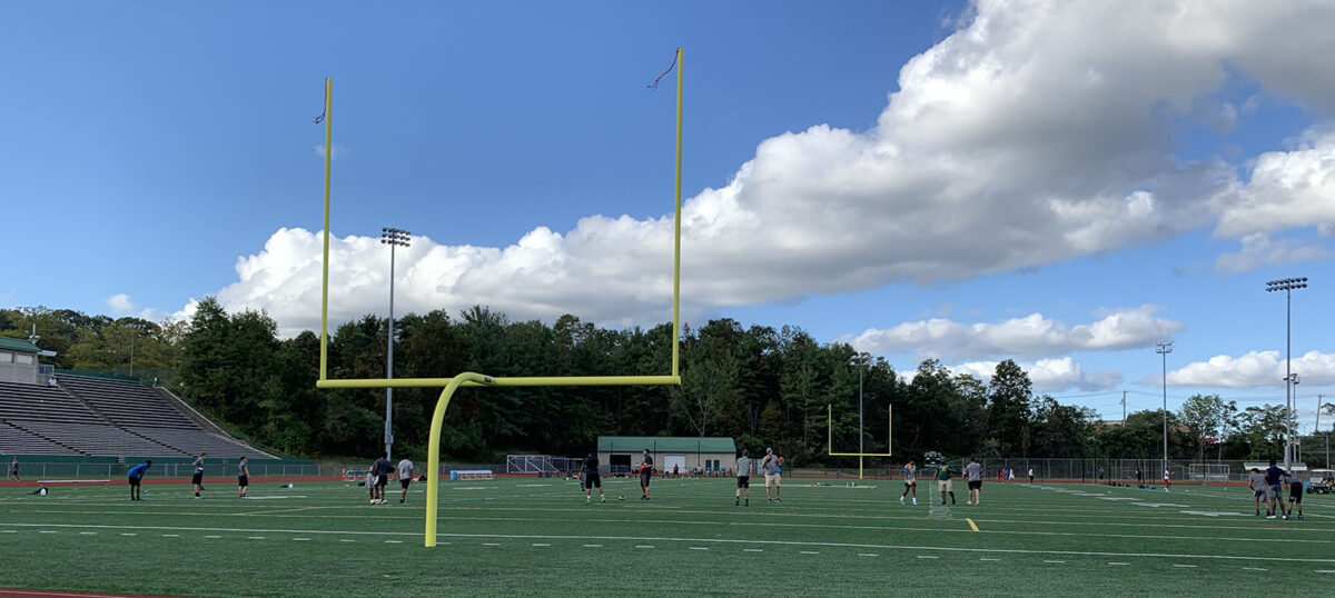Hamden High School's football players practice in a socially distant way on Sept. 1, 2020 before contact drills are allowed. (Photo by Max Schreiber)