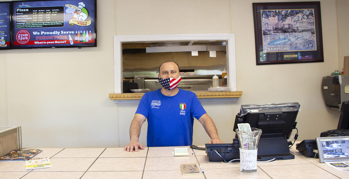 Gino Aydogdu, one of the owner's of Tonino's Pizzeria in Hamden, Connecticut, is seen in his store on Saturday, Sept. 5, 2020. He said that since students have started moving back into Quinnipiac University across the street, sales have gone up significantly. (Photo by Stephen MacLeod)