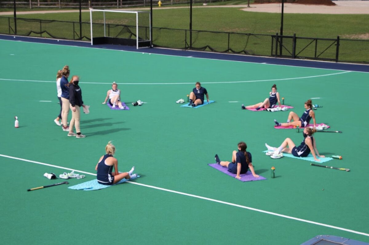 The Quinnipiac field hockey team stretches on the first day of practices. As of now, Quinnipiac has zero cases of COVID-19. (Photo by Thomas Senerchia)