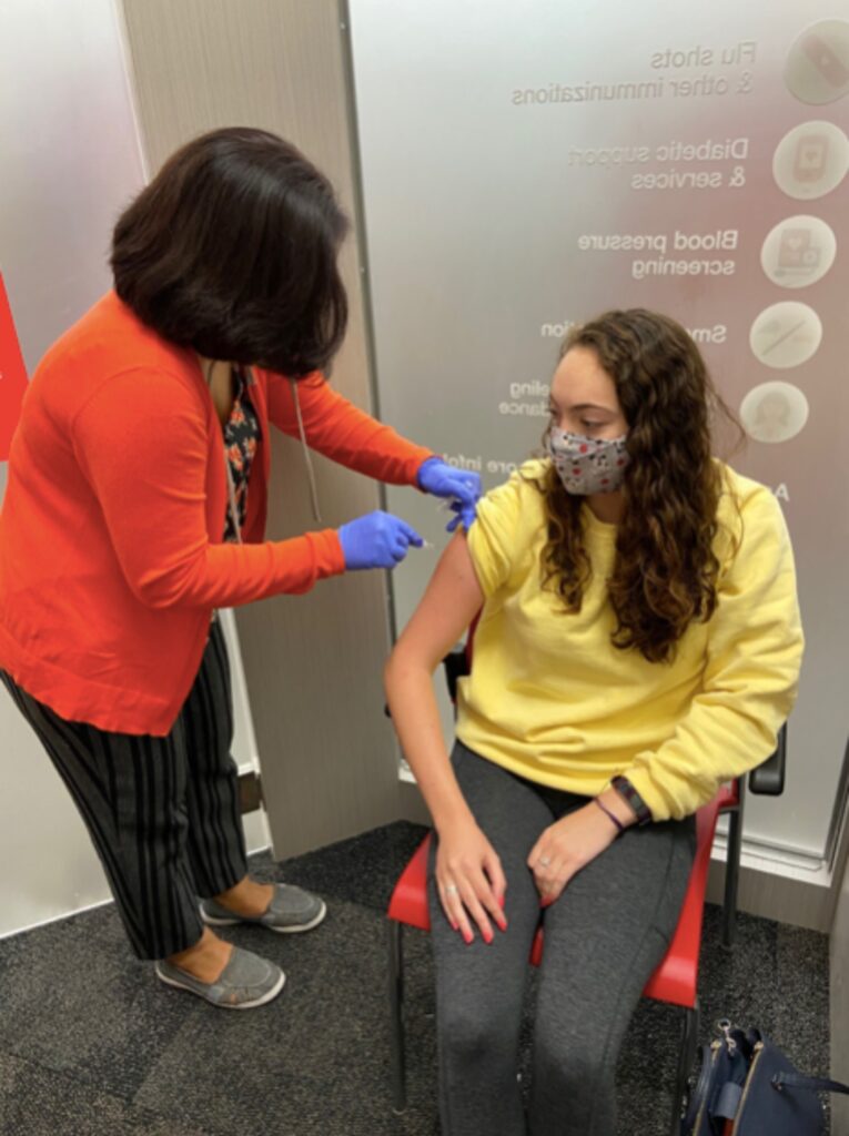 CVS technician Ratna Edwards gives Bridgette Murphy her flu shot last year. This is similar to what Quinnipiac students should expect when they get their flu shot this year. (Photo by David Rooney)