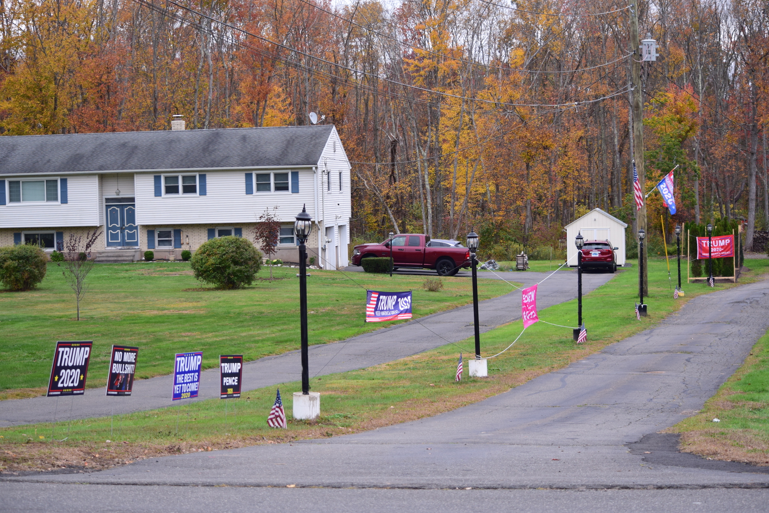 Signs for opposing political candidates are posted directly across the street from each other, causing tension throughout neighborhoods in Hamden. (photo by Jared Penna)