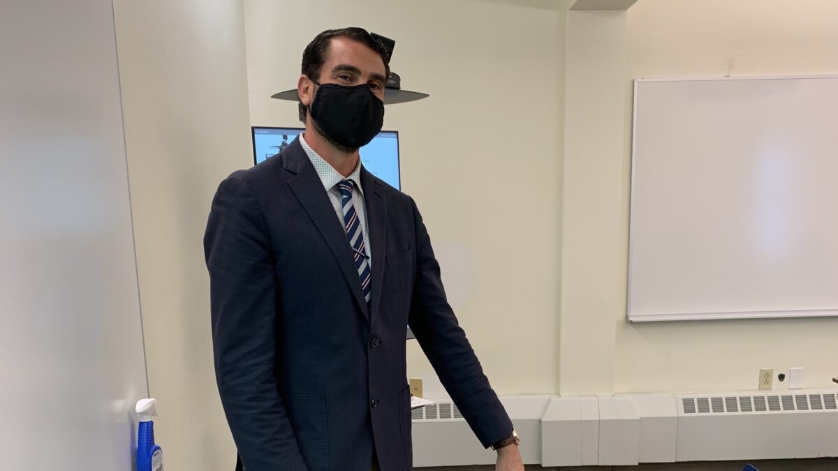 Professor Marco Scauso, an Assistant Professor of Political Science at Quinnipiac, adjusts to COVID in his classroom. Photo by Max Schreiber