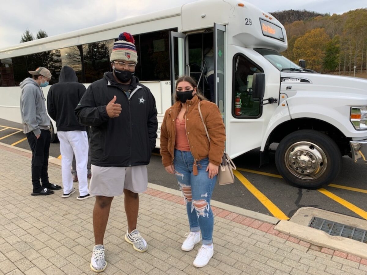 Quinnipiac students Chris Simms and Sara Ricchiuti taking the QU shuttle to a Hamden polling site.