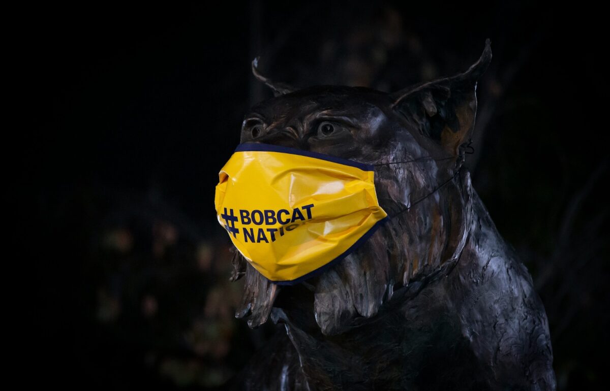 A statue on Bobcat Way wears a mask to encourage mask use at Quinnipiac University.