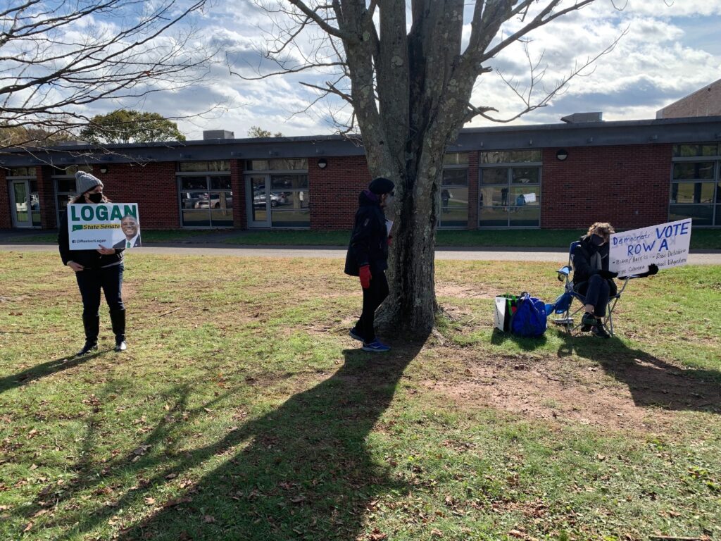 Volunteers made energetic final pitches outside polling places. 