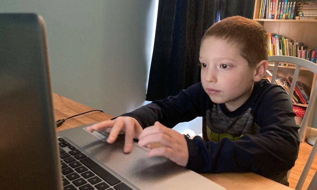 Dylan Medina virtually learning after being exposed to COVID forced him and his family into quarantine. (Credit: Kristina Medina)