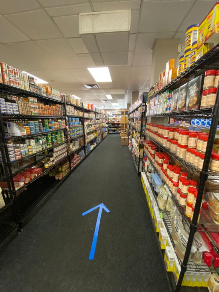 A look at the arrows installed on the floors of Whitneyville Food Center to help the flow of customers. Photo Credit: Matthew Bruin