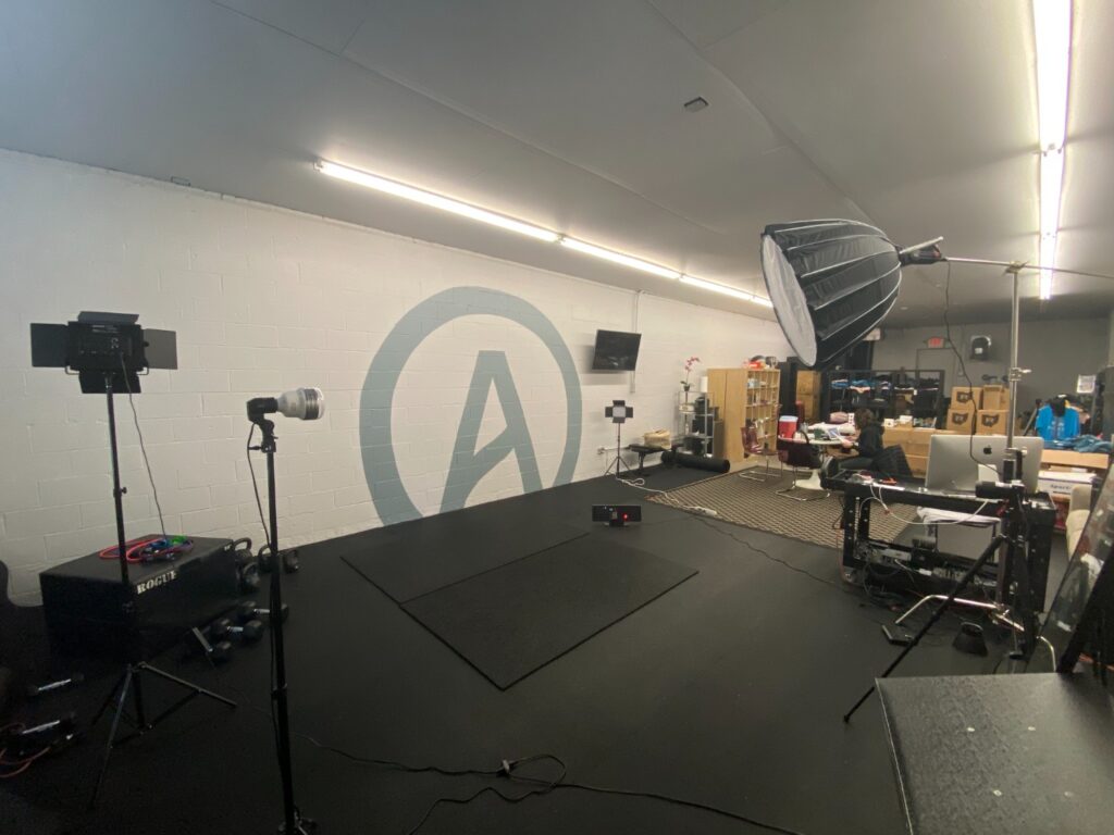 Inside Tuff Girl Fitnesses virtual workout studio.The space features professional lighting equipment along with a camera used to stream. Photo Credit: Matthew Bruin