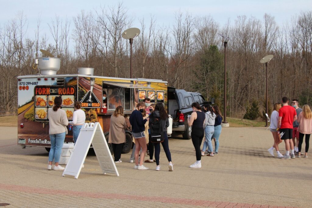 Students wait in line at a food truck provided for the event. Credit: Lauryn Yarnall