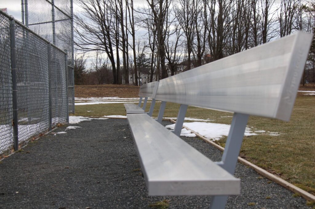 The dugout benches have been empty since the pandemic took 
away youth sports. Photo Credit: Lo Yarnall