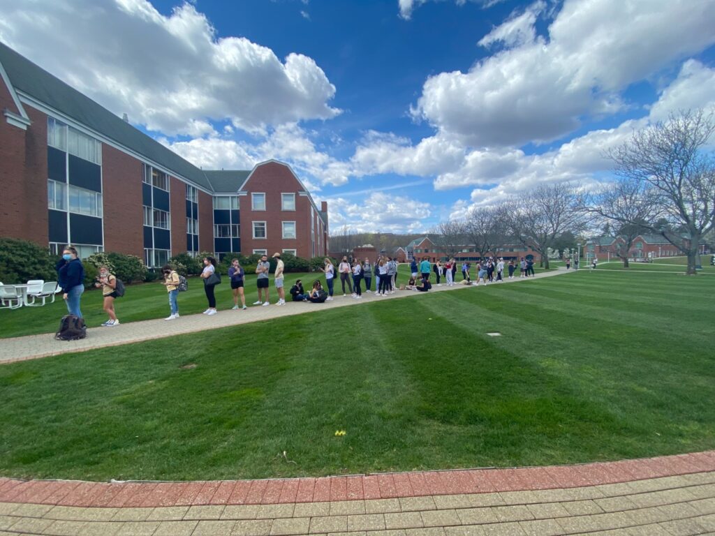 Students wait in line to enter the Quinnipiac bookstore. The line stretches across Quinnipiac’s Mount Carmel campus quad. Photo Credit: Matthew Bruin