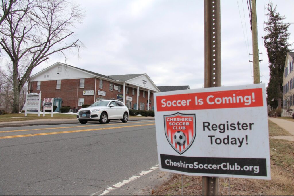 Cheshire Soccer Club has signs on Main Street reminding parents to sign up their kids. 
Photo Credit: Lo Yarnall
