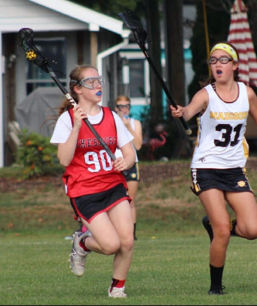 Tema Caplan, 13, with the ball in a lacrosse game before COVID-19. Photo provided: Jean Caplan