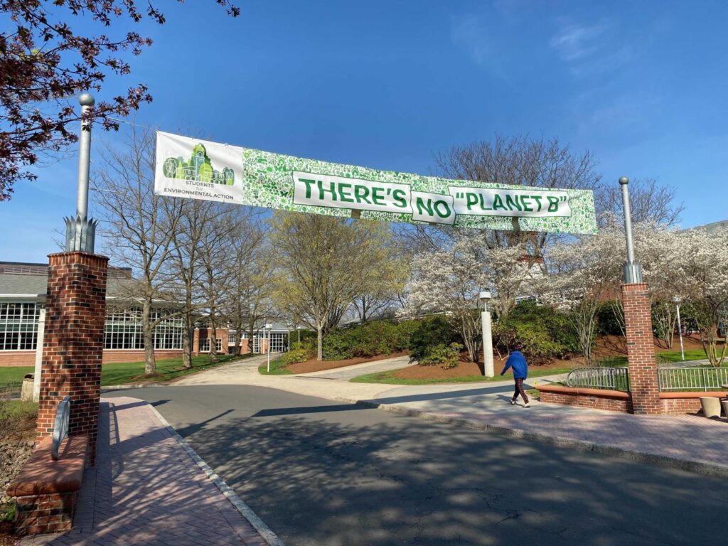 A banner hangs at Quinnipiac Universities Bobcat Way promoting an environmental message that “There’s No Planet B!”  Photo Credit: Lo Yarnall