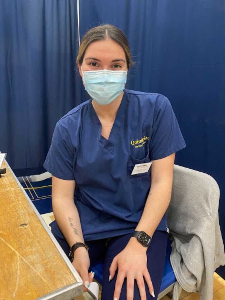 Elizabeth Callao preparing to administer the COVID vaccine to QU students. Photo by MiriYam Judd.