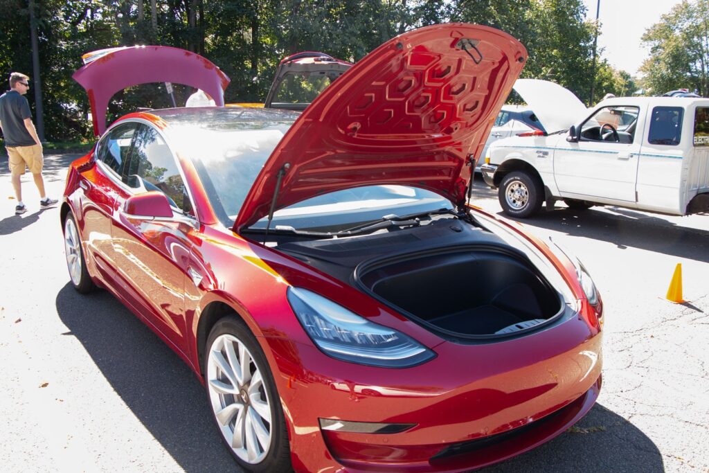 Red Tesla Y series on display at the EV car show.