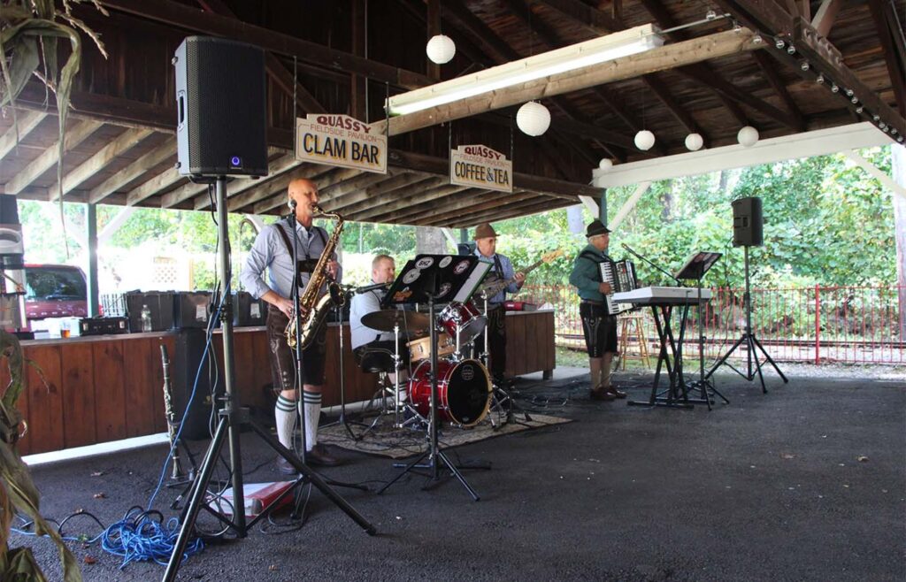 German Band playing in the Pavilion as people eat and drink. Photo by Will Knox